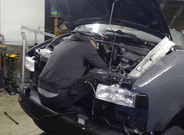 Mechanic conducts an inspection on no-start engine to diagnose the issue