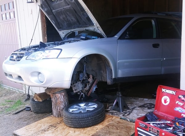 Car prepared for engine replacement in a clients garage